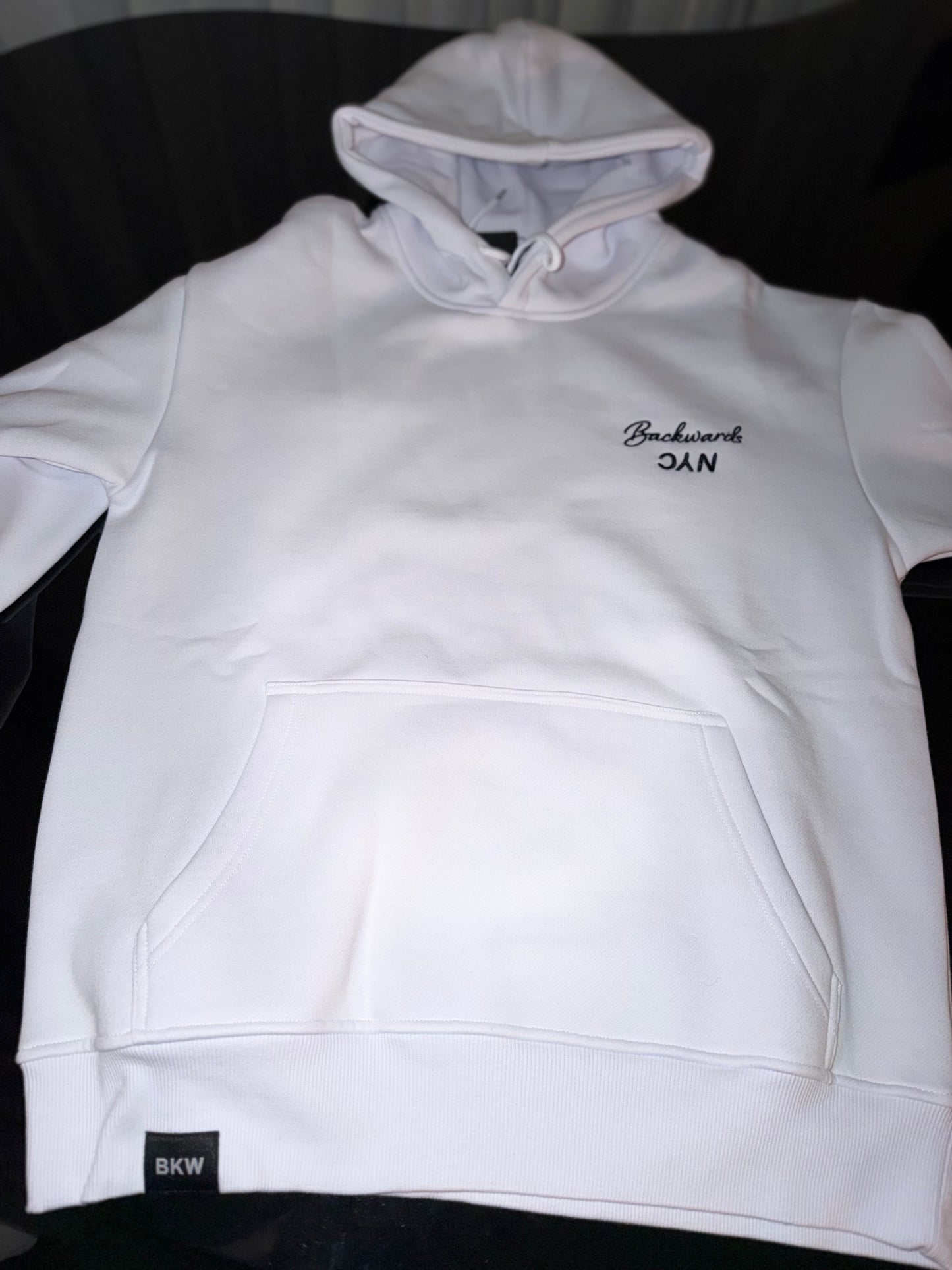 BackwardsNYC Ultimate Comfort and Style: Premium Fabric Hoodie for Men/Women. Black on White, Left Chest
